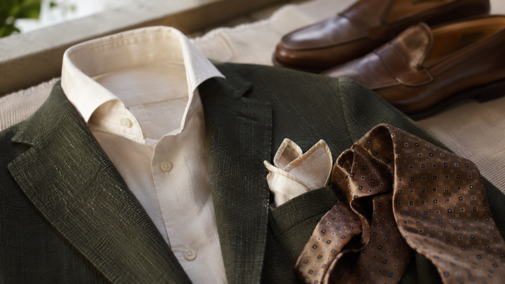Detail of an Italian jacket, shirt and men’s accessories